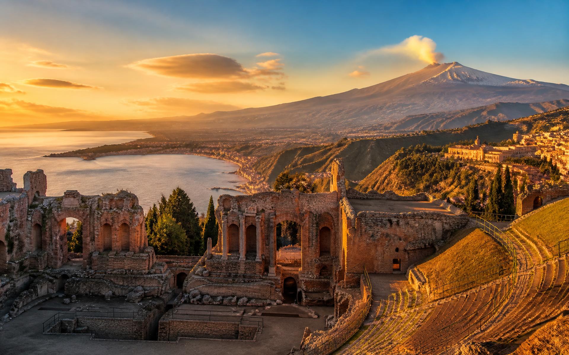The Ancient Theatre of Taormina at sunset with Mount Etna beyond